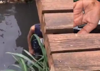 Crianças são vistas pescando em canal de esgoto por falta de alimentos no bairro Nova Esperança